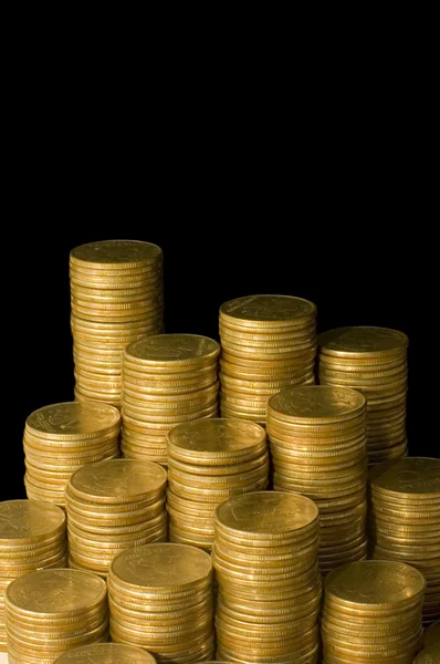 Gouden munten geïsoleerd op zwart — Stockfoto