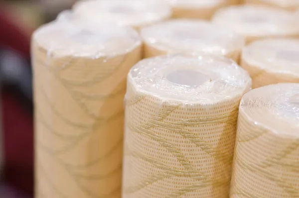Rolls of wall-paper in a supermarket — Stock Photo, Image