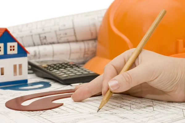 Hand with a pencil on architect plan — Stock Photo, Image