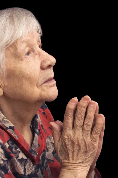 歳の女性は黒に祈る — ストック写真