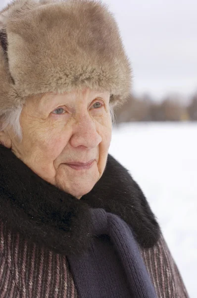 Portrait of the old woman in the winter — Stock Photo, Image