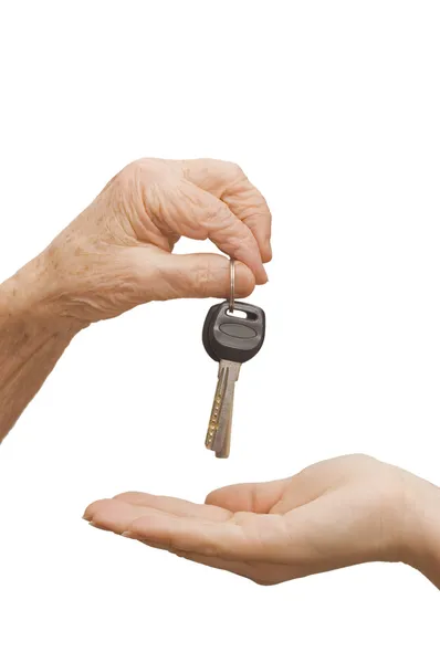 Keys from old hands in the young — Stock Photo, Image