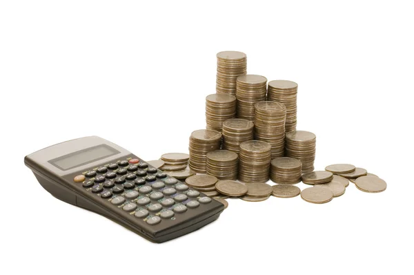 Monedas y calculadora aisladas en blanco — Foto de Stock