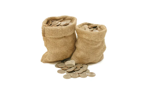 Geldmünzen in Tüte isoliert auf weiß — Stockfoto