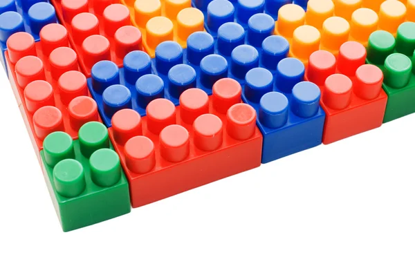 Blocos de plástico multi-coloridos em branco — Fotografia de Stock