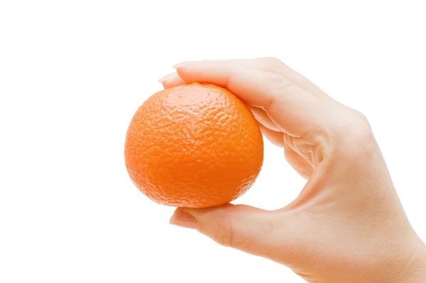 Tangerine in een vrouwelijke hand geïsoleerd — Stockfoto