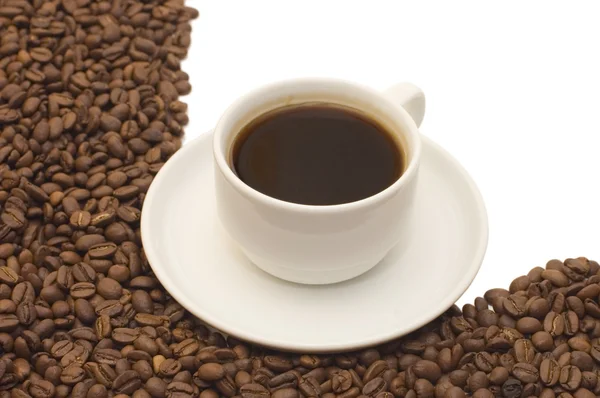 Koffiekopje en graan op wit — Stockfoto