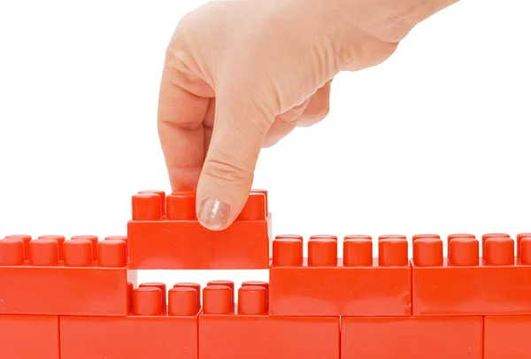 Hand with the toy block isolated — Stock Photo, Image