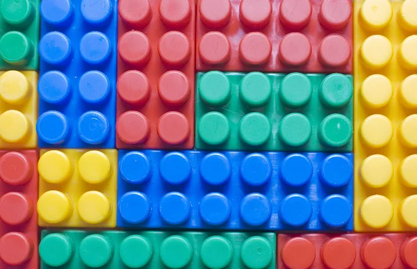 Blocs en plastique coloré comme fond — Photo