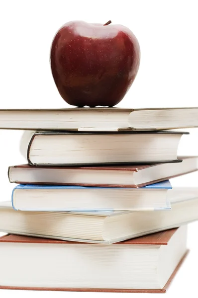 Red apple on a pile of books — Stock Photo, Image