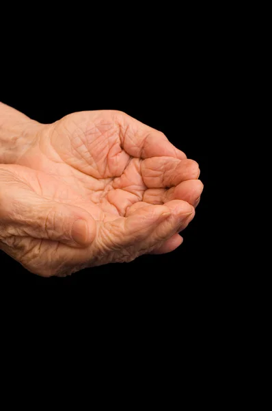 The old hands begging on the black — Stock Photo, Image