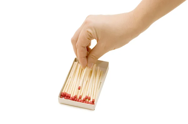 Hand takes out a match from a matchbox — Stock Photo, Image