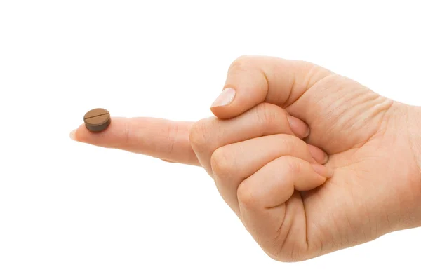 Tablette auf einem Finger einer weiblichen Hand — Stockfoto