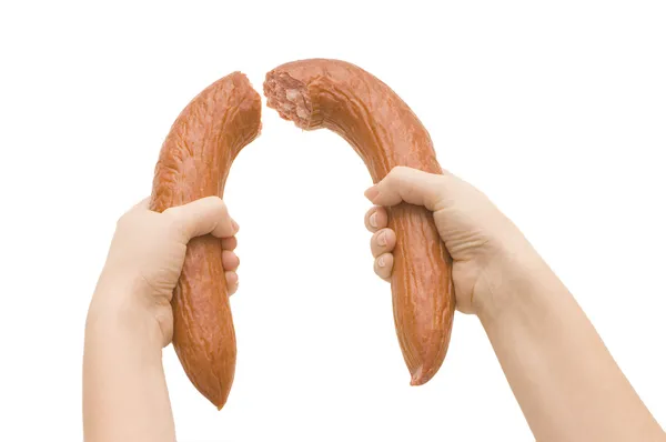 Разбитая колбаса в изолированной руке — стоковое фото