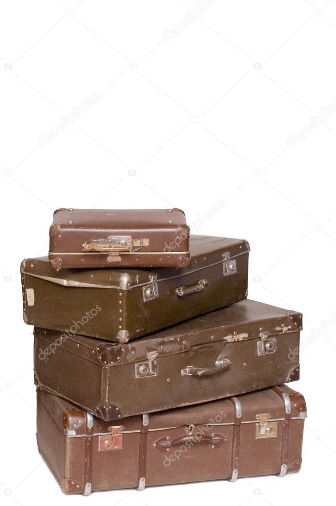 Heap of old suitcases isolated