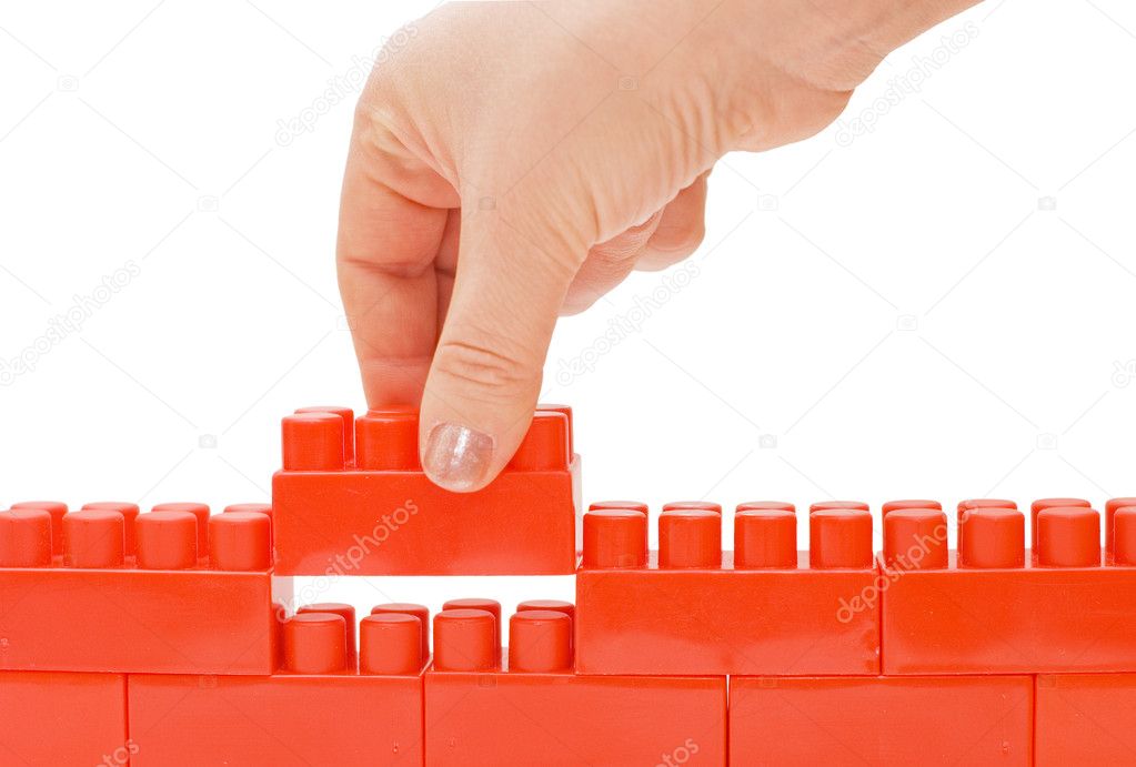 Hand with the toy block isolated