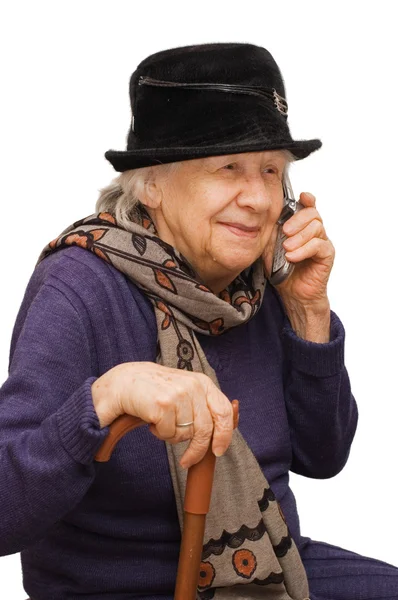 Bir cep telefonu ile konuşurken büyükanne — Stok fotoğraf
