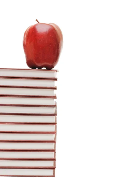 Stack of books and apple isolated — Stock Photo, Image