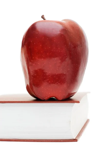 Manzana roja en el libro aislado —  Fotos de Stock