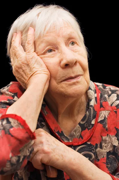 黒に悲しい古い女性 — ストック写真