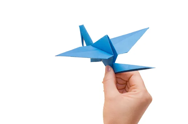 Origami crane in hand isolated — Stock Photo, Image