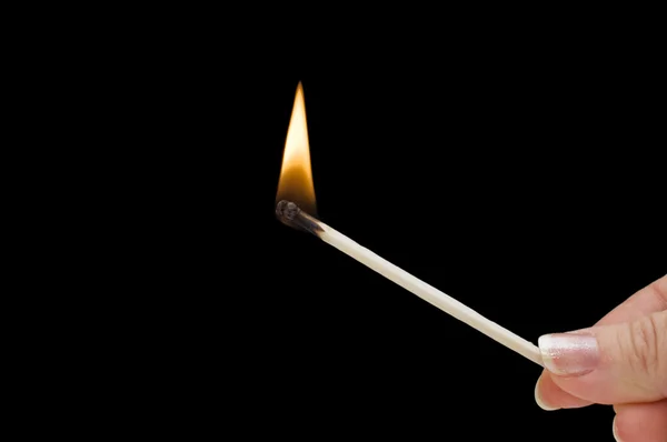 Hand holding burning match stick — Stock Photo, Image