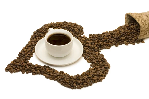 Tazza da caffè su grani di caffè — Foto Stock