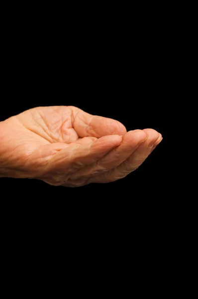 Gamla handen tigger på svarten — Stockfoto