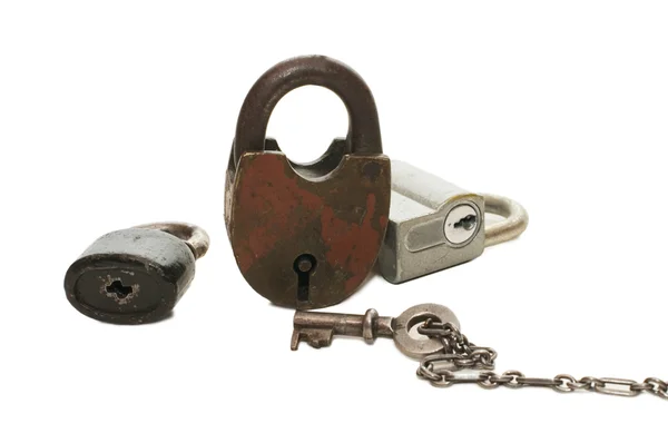 Cerradura y llave sobre fondo blanco Imagen de archivo
