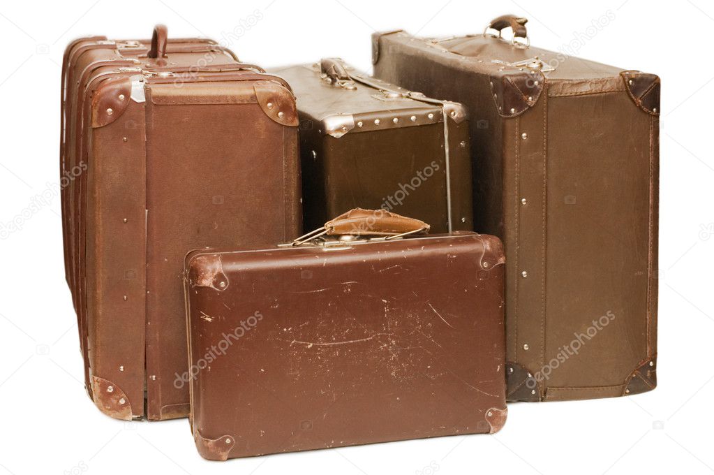 Heap of old suitcases isolated
