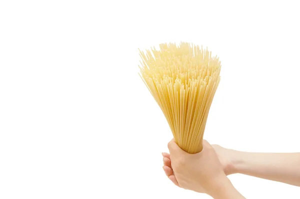 Spaghetti in the hand isolated on white — Stock Photo, Image