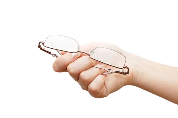 Glasögon i en kvinnlig hand isolerade — Stockfoto