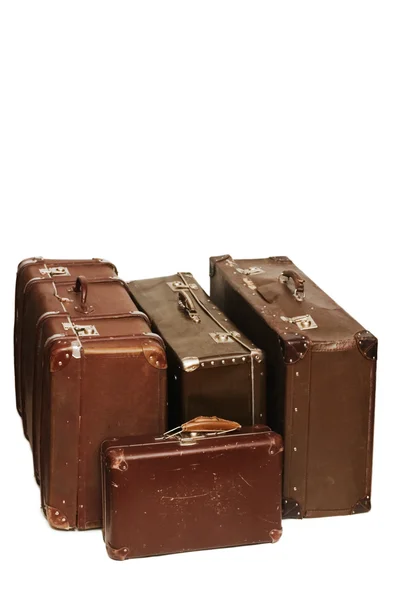 Heap of old suitcases isolated on white — Stock Photo, Image