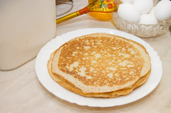 Plate with pancakes on a table — Stock Photo, Image