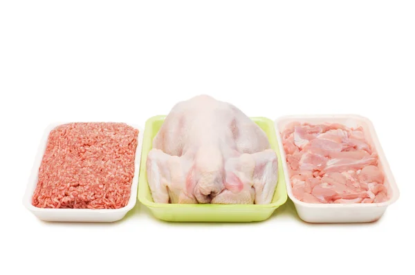 Assortment of crude meat in trays — Stock Photo, Image