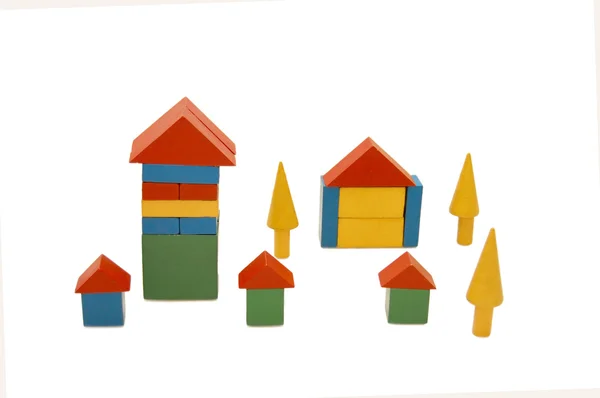 Building from wooden colourful childrens blocks — Stock Photo, Image