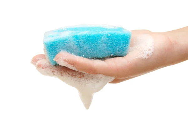Hand and kitchen sponge in soapsuds — Stok fotoğraf