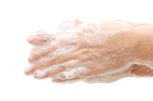 Weibliche Hände in Seifenlauge isoliert auf weiß — Stockfoto