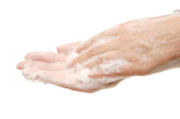 Vrouwelijke handen in sopje geïsoleerd op wit — Stockfoto