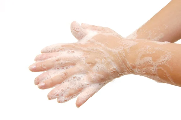 Weibliche Hände in Seifenlauge isoliert — Stockfoto