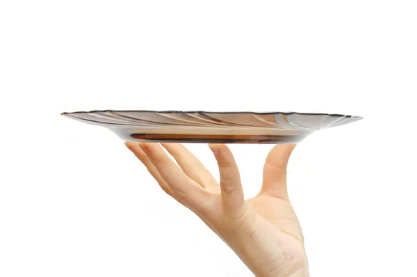 Empty glass plate in a female hand , isolated on — Stock Photo, Image