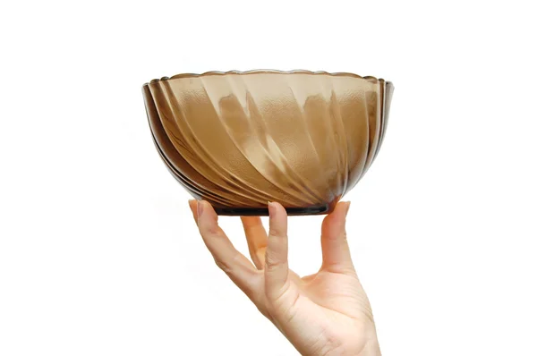 Empty glass dish in a female hand, isolated on w — Stock Photo, Image