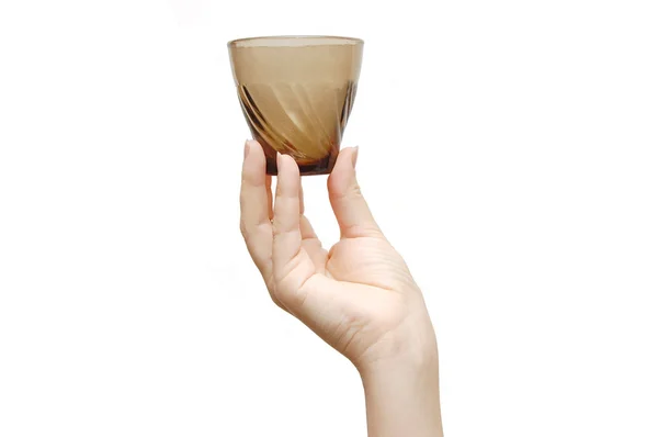 Empty glass cup with a saucer in a female hand, — Stock Photo, Image