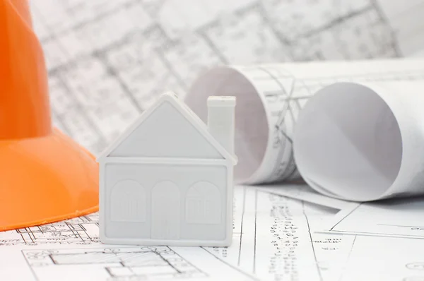 Toy house model on blueprints — Stock Photo, Image