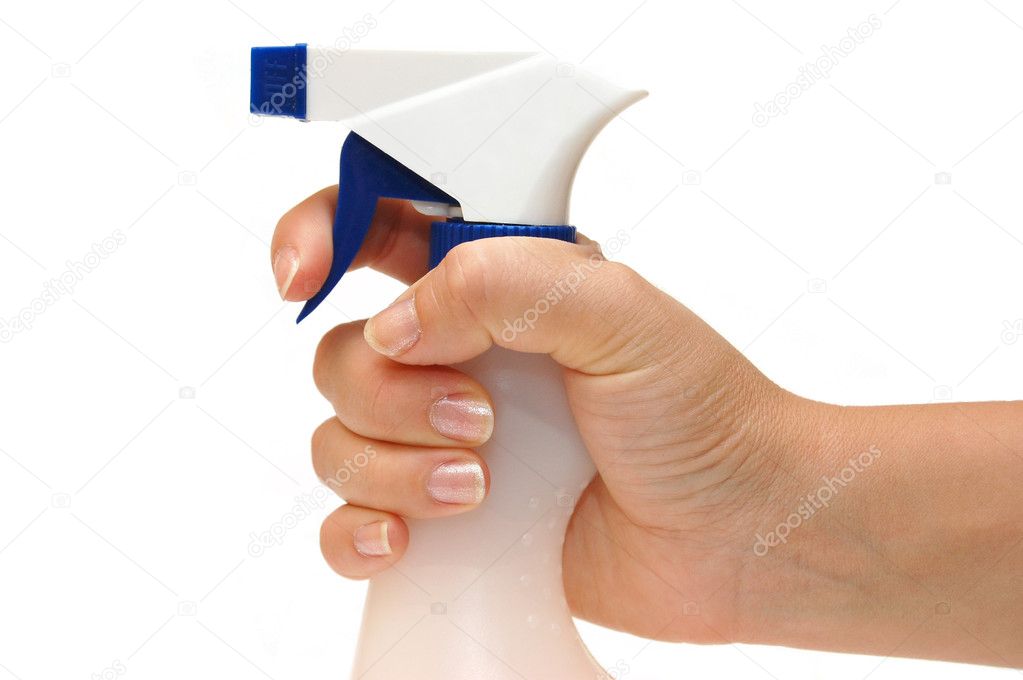 Spray bottle in hand isolated on white