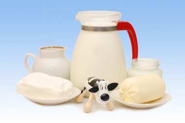 Set of dairy products and a toy cow clipart