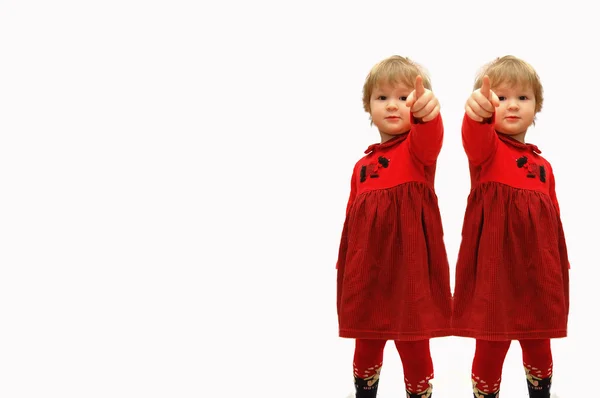 Two girls with the extended finger forward on a — Stock Photo, Image