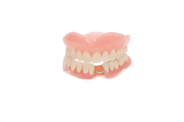 Zubní protézy na bílém pozadí — Stock fotografie