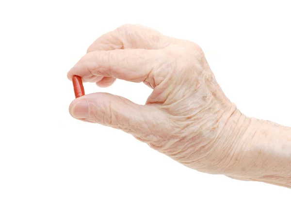 Starszy ręcznie z tabletek na białym tle — Zdjęcie stockowe