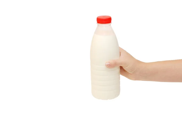 Ręka z butelki mleka na białym tle — Zdjęcie stockowe
